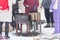 Preparation of pancakes by a group of people on a fire on frying pans in winter for the Maslenitsa holiday.