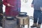 Preparation of pancakes by a group of people on a fire on frying pans in winter for the Maslenitsa holiday