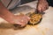 Preparation of passatelli fresh pasta using traditional tool