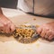 Preparation of passatelli fresh pasta using traditional tool