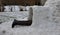 Preparation for the polar expedition, sleeping and survival in the igloo. The man is lying in a snow house and his feet in leather