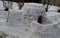 Preparation for the polar expedition, sleeping and survival in the igloo. The man is lying in a snow house and his feet in leather