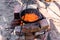 Preparation of raditional armenian pilaf in a cauldron on an open fire