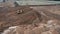 Preparation of site for apartment high building. Bulldozer digging sand sandy quarry on construction apartment buildings