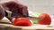 Preparation slice the tomatoes closeup