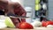 Preparation slice the tomatoes closeup