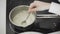 Preparation and Stirring Oatmeal in pan on the kitchen stove