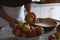 Preparation, Thanksgiving Day celebration. The chef selects apples for a traditional apple pie. In the background is a pan with