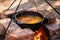 Preparation of traditional Armenian pilaf in a cauldron on an open fire