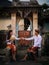 Preparation for traditional Balinese ceremony. Multicultural couple making Hindu religious ceremony with offerings. Caucasian wife