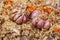 The preparation of traditional Uzbek pilaf with meat, carrots, garlic and spices