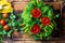 Preparation vegetable bouquet of tomatoes, lettuce, bell paper. Cutting board