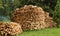 Preparation for winter with round pile stacked firewood