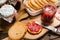 Preparations of breakfast with rusks and strawberry jam