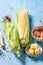 Preparations for grilling fresh corncob with butter and salt