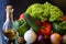 Preparations for a wonderful vegetarian dinner. Washed Bulgarian pepper  green cucumbers  onions  garlic  lettuce leaves and a