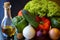 Preparations for a wonderful vegetarian dinner. Washed Bulgarian pepper, green cucumbers, onions, garlic, lettuce leaves and a