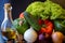 Preparations for a wonderful vegetarian dinner. Washed Bulgarian pepper, green cucumbers, onions, garlic, lettuce leaves and a