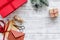 Prepare new year and christmas 2018 presents in boxes and envelopes on wooden background top veiw mockup