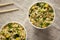 Prepared instant noodles with beef flavoring in cups. Flat lay, from above, overhead. Close-up