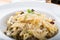 Prepared penne pasta with chicken and forest mushroom sauce, cheese with parmesan and mozzarella