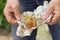 Prepared potato on foil in male hands