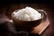 Prepared rise in bowl for cooking asian food rolls or sushi close up on wooden board. Selective focus. Asian food