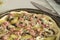 Prepared uncooked pizzas for baking ingredients, food background, concept of homemade pizza closeup