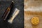 Preparing beer. Barley near beer bottle and glass on black and canvas background top view mockup