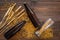 Preparing beer. Barley near beer bottle and glass on wooden background top view copyspace