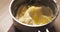 Preparing choux dough in saucepan