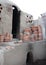 Preparing clay pottery for firing in adobe furnace, Fez, Morocco