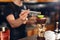 Preparing Cocktails. Bartender Making Cocktail In Bar