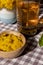 Preparing Dandelion flower healthy tea in glass cup on table. Herbal medicine Delicious tisane tea from with fresh