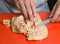 Preparing and de veining foie gras on a red cutting board. meat preperation