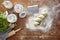 Preparing dough flour on wooden table kitchen scene