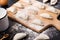 Preparing dumplings on a dark table