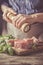 Preparing filet mignon - hands seasoning the steak