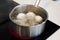 Preparing food on casserole pan on a electric stove, close-up. Cook egg process