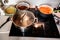 Preparing food in pots on hot ceramic cooktop in kitchen