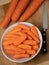 Preparing fresh carrots on wood table