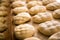 Preparing fresh loaves of bread in a bakery