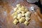 Preparing fresh natural ravioli on wooden kitchen table