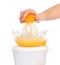 Preparing fresh orange juice with juicer