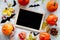 Preparing for halloween. Black desk for notes among pumpkins and bats on grey background top view mockup