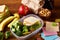 Preparing ham sandwiches for scool lunchbox on wooden background, close up.