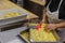 Preparing Italian Stuffed Tortelli on a Long Wooden Table