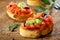 Preparing Italian tomato bruschetta