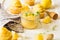 Preparing lemon cupcakes with citrus curd