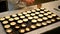 Preparing mini pancakes close-up view - LONDON, ENGLAND - DECEMBER 10, 2019